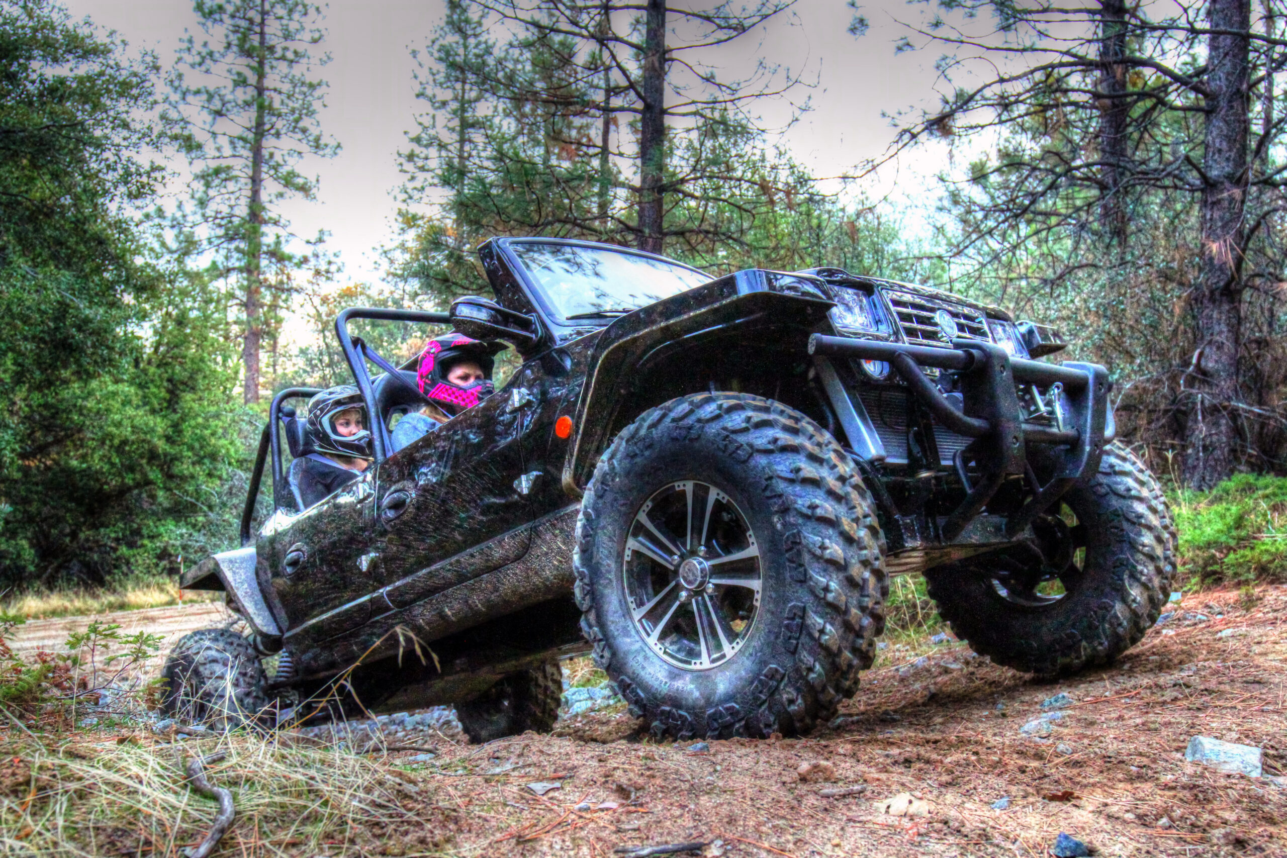 Oreion Reeper driving through a forest trail