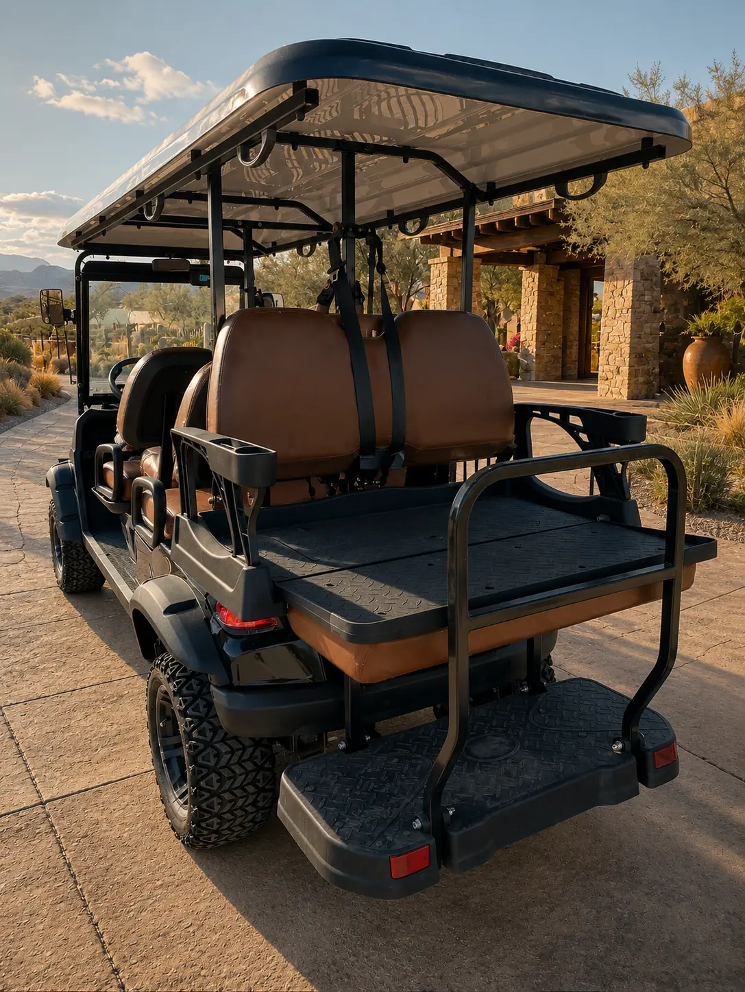 Rear three-quarter view of an Oreion 4–6 passenger golf cart with its rear platform in cargo mode