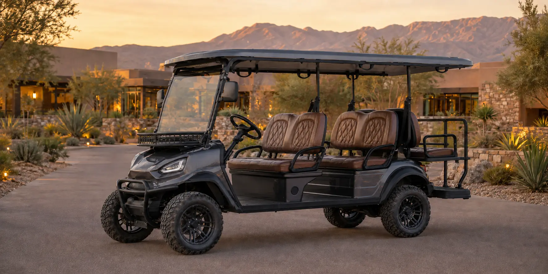Premium dark gray Oreion 4 to 6 passenger electric golf cart at a desert resort