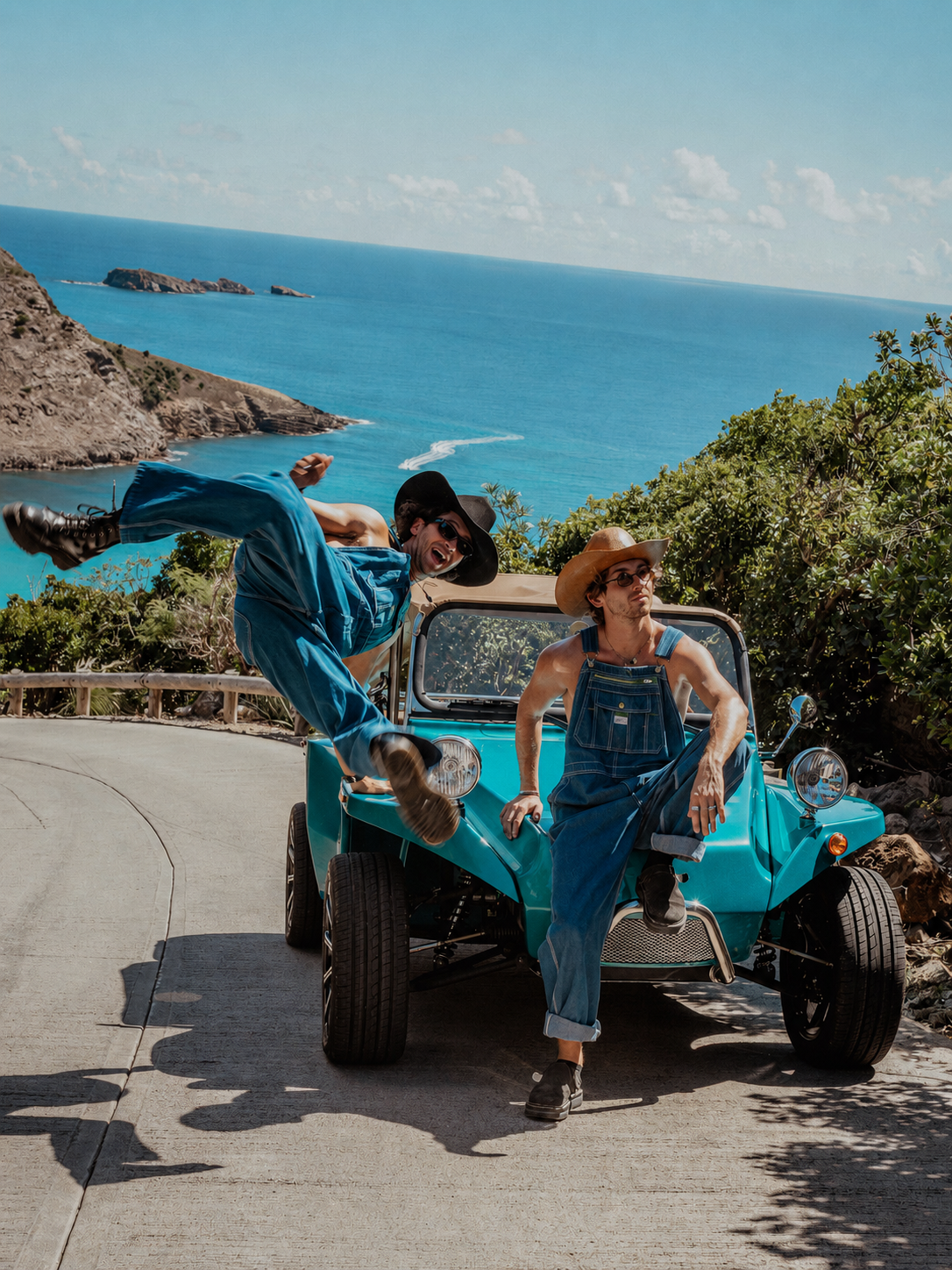 Turquoise Oreion Beach Buggy with two drivers overlooking the coast