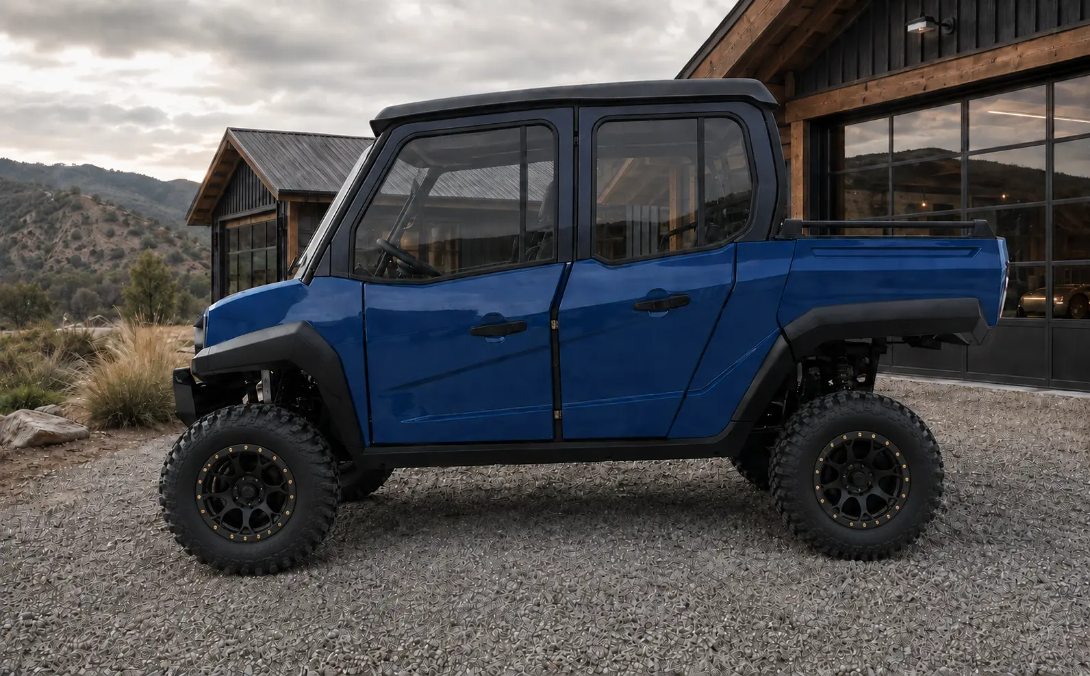 Side profile of the blue Oreion Trailwarden 1000 with its optional full hard-cab enclosure