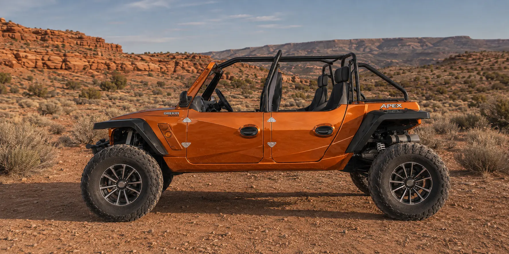 Photorealistic orange four-door Oreion Reeper Apex 1100 on a red-rock trail